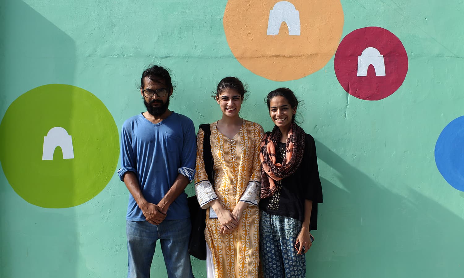 Veera Rustomji (in the middle) along with other artists with their artwork